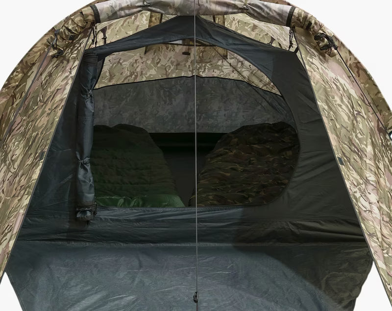 Camouflage tent interior with sleeping bags inside