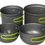 Set of four gray cookware pots with green handles on a white background