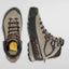 Pair of hiking boots with visible brand logo on a light gray background