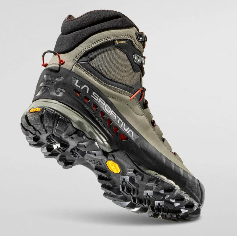 Hiking boot with LA Sportiva branding on a light gray background
