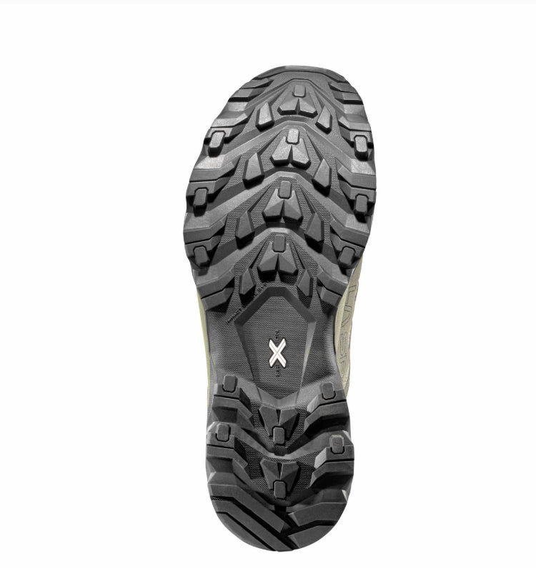 Close-up of a hiking boot sole with tread pattern on a white background