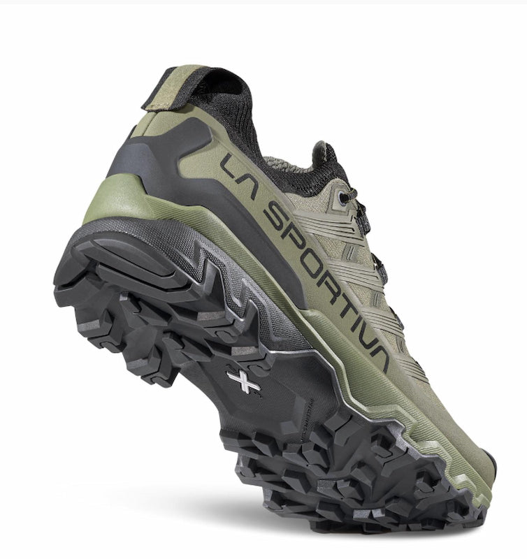 Green and black hiking shoe with 'La Sportiva' branding on a white background