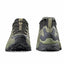 Pair of green hiking shoes with black soles on a white background