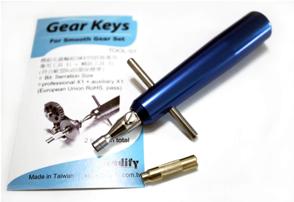Blue tool with accessories on a white background