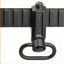 A black metal quick-release sling clip with a hanging loop, shown attached to a black sling strap against a white background.