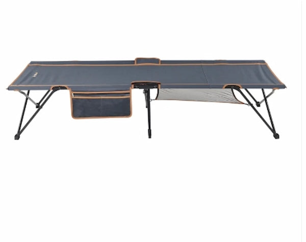 Portable folding bed with mesh design on a white background