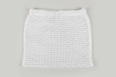 A white open-knit mesh mini skirt with an elastic waistband, shown flat against a solid light gray background.