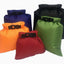 Five colorful dry bags with buckles on a white background