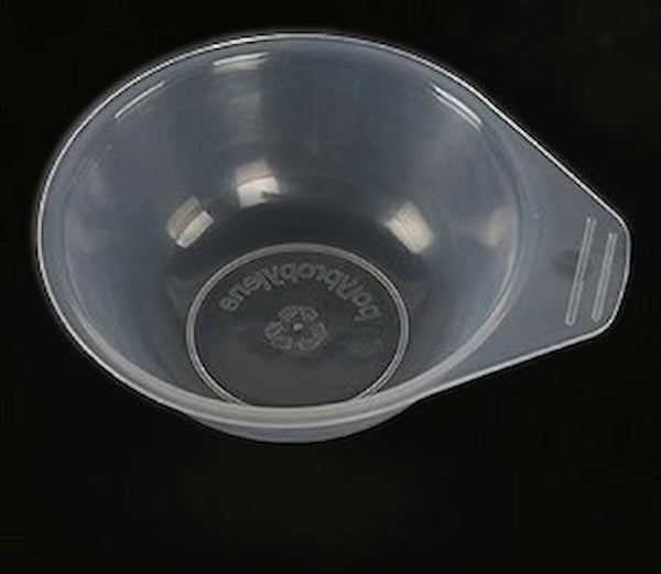 Clear plastic measuring cup with brand logo on a black background