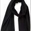 Black scarf draped over a white background