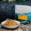 Back Country Elite backpacking food package with a bowl of food on a natural background