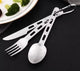 Set of silver cutlery with a carabiner on a black surface
