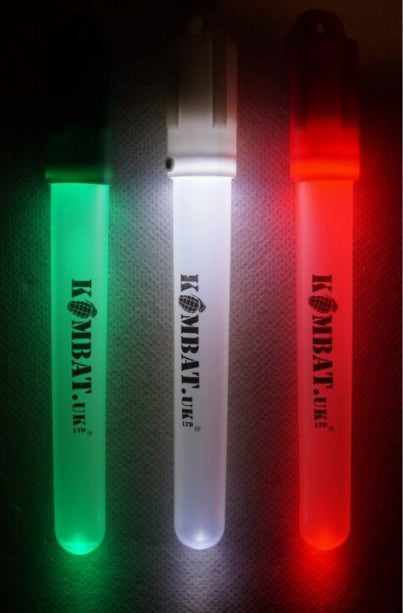 Three glow sticks in green, white, and red with 'Kombat UK' branding on a dark textured background.