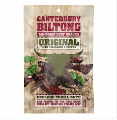 Canterbury Biltong air-dried beef snacks packaging with a wooden texture background.