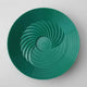 Green plastic lid with a textured surface on a white background