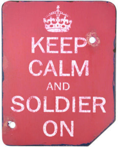 Red sign with 'Keep Calm and Soldier On' text and a crown symbol.